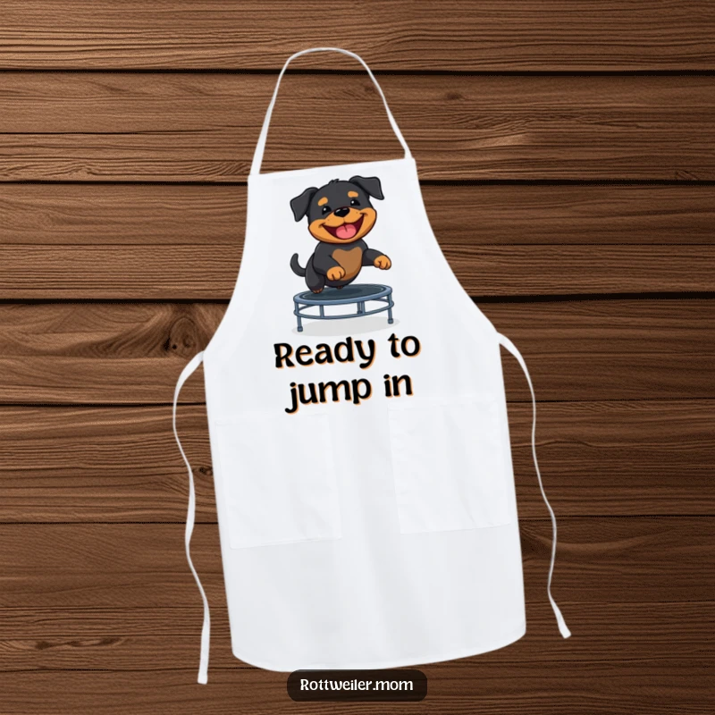 Funny Rottweiler puppy energetically bouncing on a trampoline, a delightful detail on this kitchen apron.