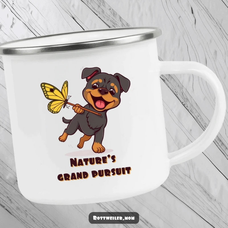 Funny Rottweiler Butterfly Camping Mug shows an excited dog with a net, chasing a giant butterfly, ready for outdoor fun.