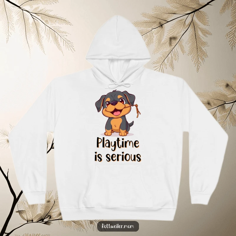 Funny Rottweiler hoodie featuring a playful pup with happy eyes, batting at a dangling string, cozy and full of fun.