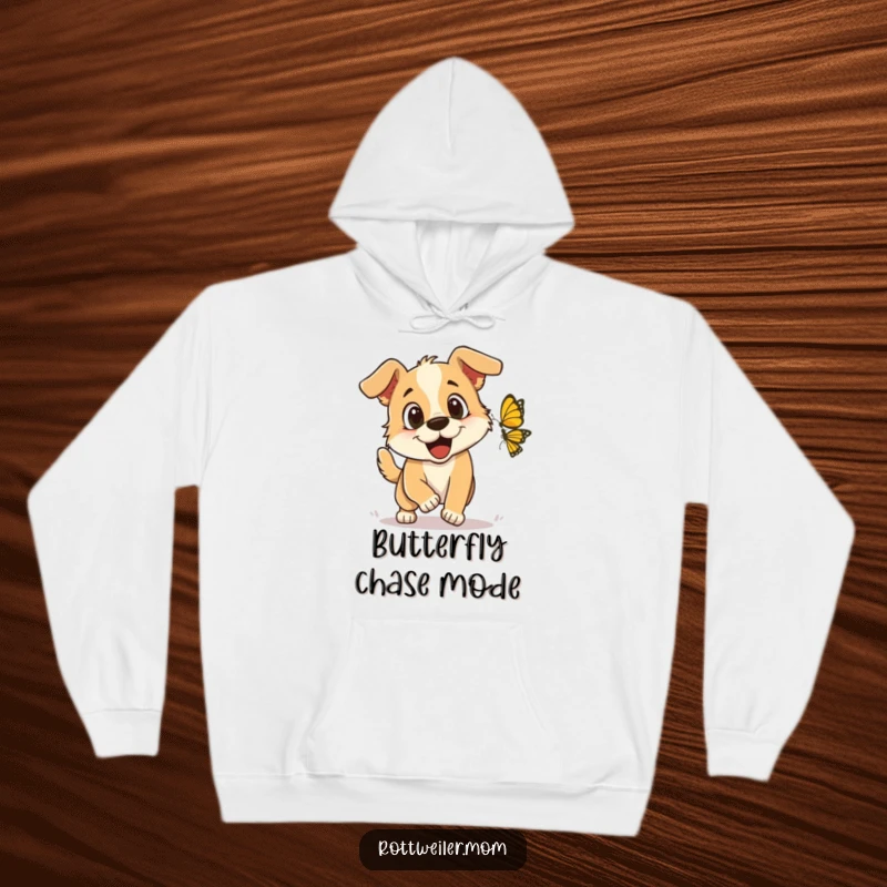 Funny Hoodie: A joyful dog with sparkling eyes enthusiastically chasing a butterfly, symbolizing freedom and playful exploration.