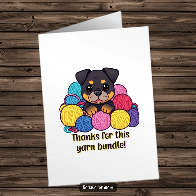 Funny Free Printable Thank You Card: A kawaii Rottweiler peeking from a colorful pile of yarn balls, sending thanks with a playful, cozy charm.