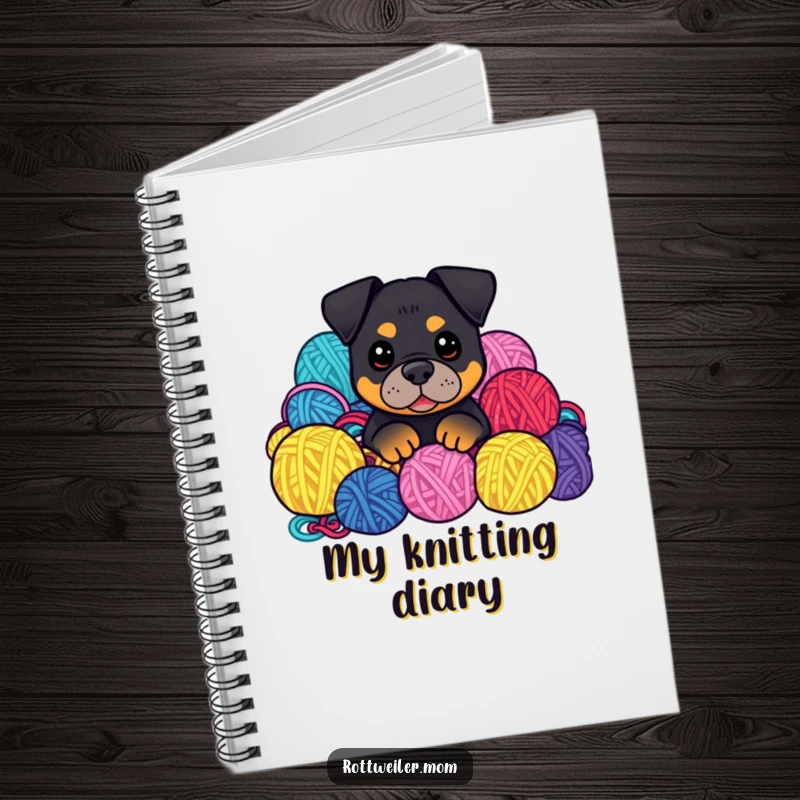 Funny Kawaii Rottweiler peeking from yarn balls on a notebook cover, inspiring creative projects.