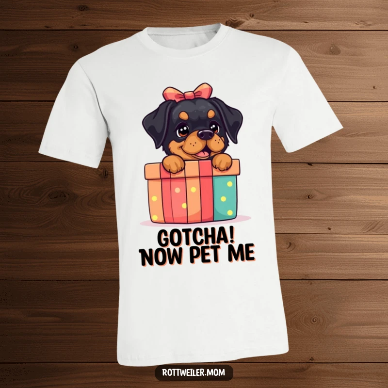 Funny Rottweiler Gift Box T-Shirt: A rottweiler peeking out of a gift box, perfect for celebrations and humor.