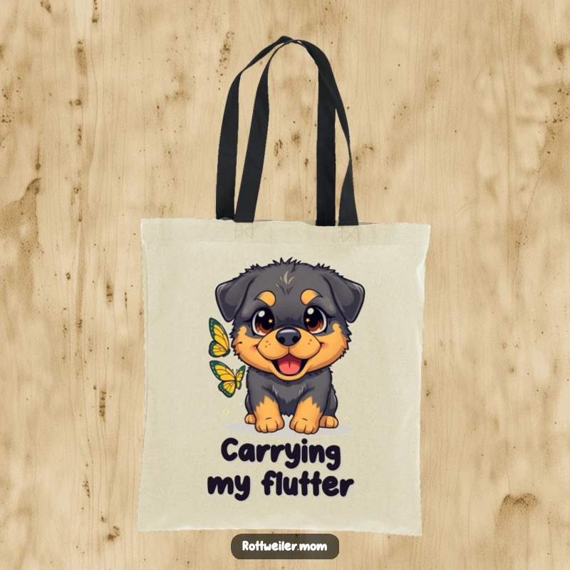 Funny tote bag showcasing a fluffy Rottweiler with oversized, sparkling eyes gleefully chasing a butterfly, great for everyday use.