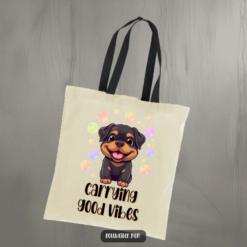 Funny tote bag with a smiling Rottweiler surrounded by floating, colorful bubbles, perfect for carrying items with canine charm and humor.